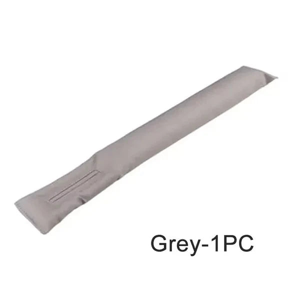 Travel "seat gap" bolster keeps your phone, keys, glasses, wallet from falling between car seats.