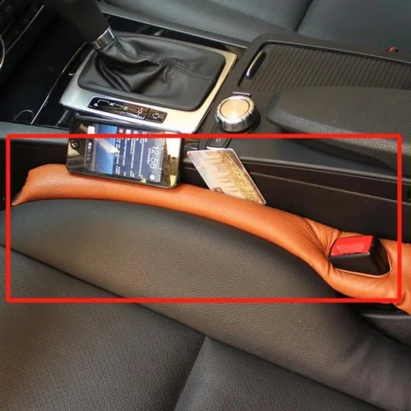 Travel "seat gap" bolster keeps your phone, keys, glasses, wallet from falling between car seats.